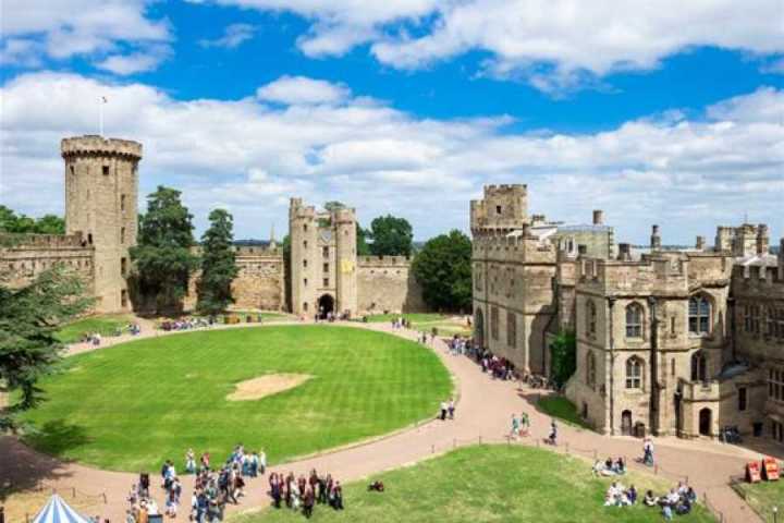 a castle on top of a grass covered field