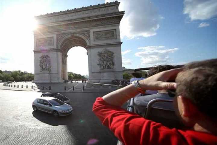 a man sitting in front of a building