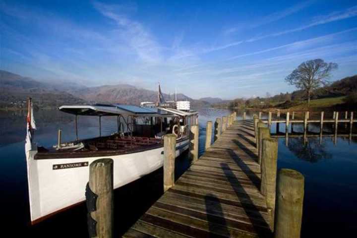 a wooden boat in a body of water