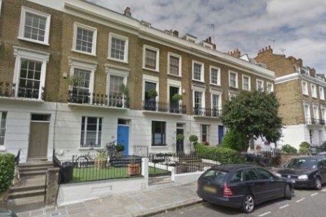 a car parked on the side of a building