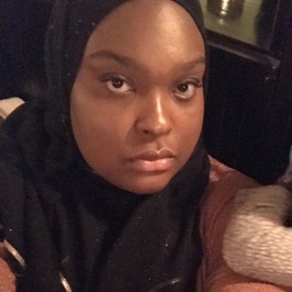 a woman who is smiling and looking at the camera