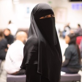 a person holding a bag of luggage