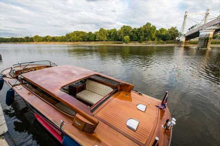 a boat that is sitting on the side of a river