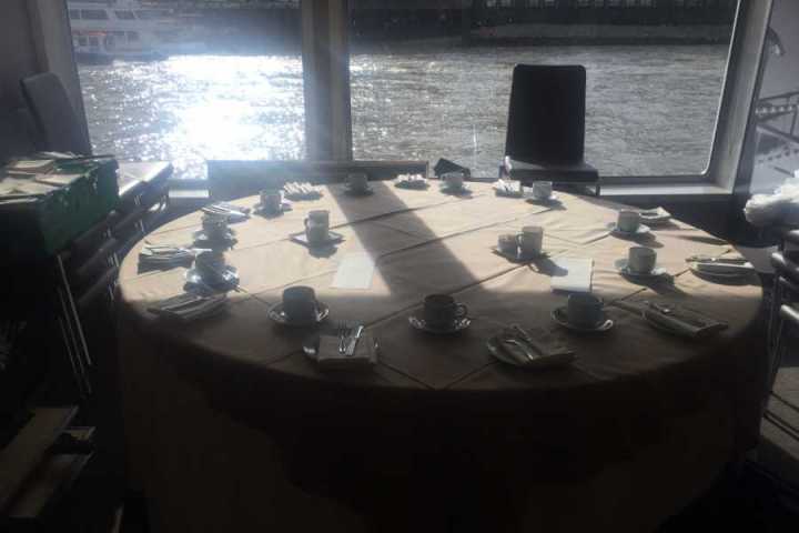 a desk with a laptop computer sitting on top of a table