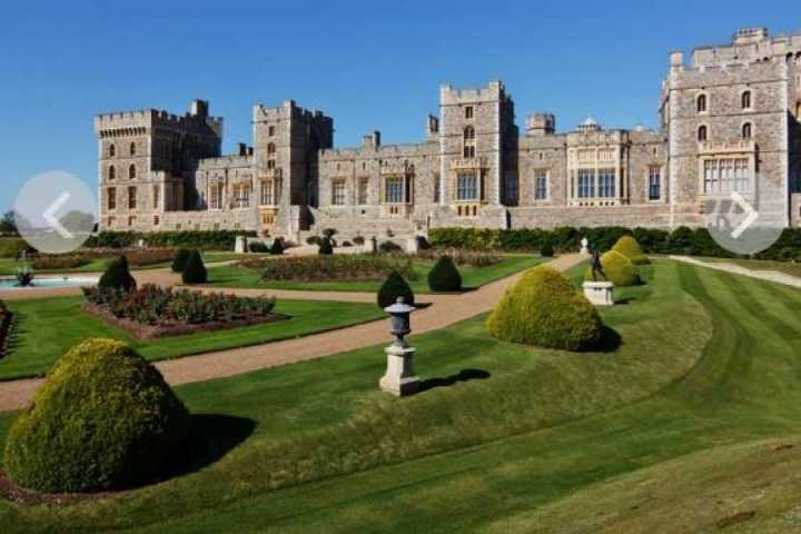 a castle on top of a grass covered field