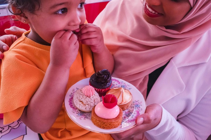 a man and a woman eating a donut