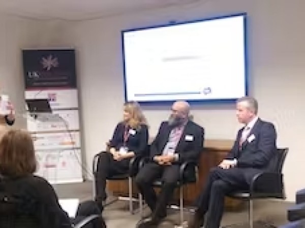 a group of people sitting at a desk