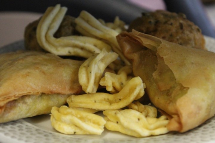 a close up of a sandwich and fries on a plate