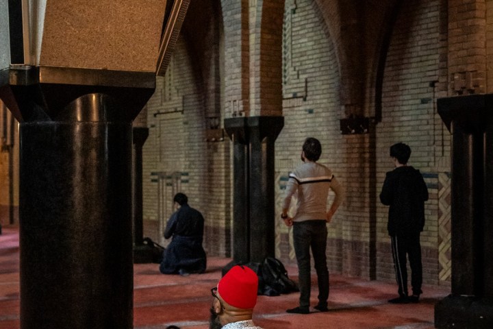 a person sitting in front of a building